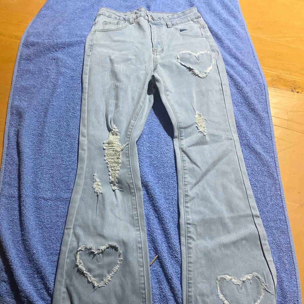 Light jean with rips and hearts